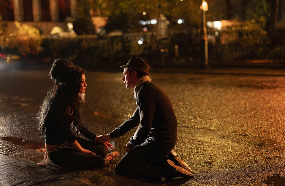 This image released by Focus Features shows Marisa Abela as Amy Winehouse, left, and Jack O'Connell as Blake Fielder-Civil, in a scene from "Back to Black." (Focus Features via AP)