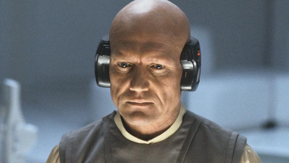 Bald Lobot with computer attached around the back of his head