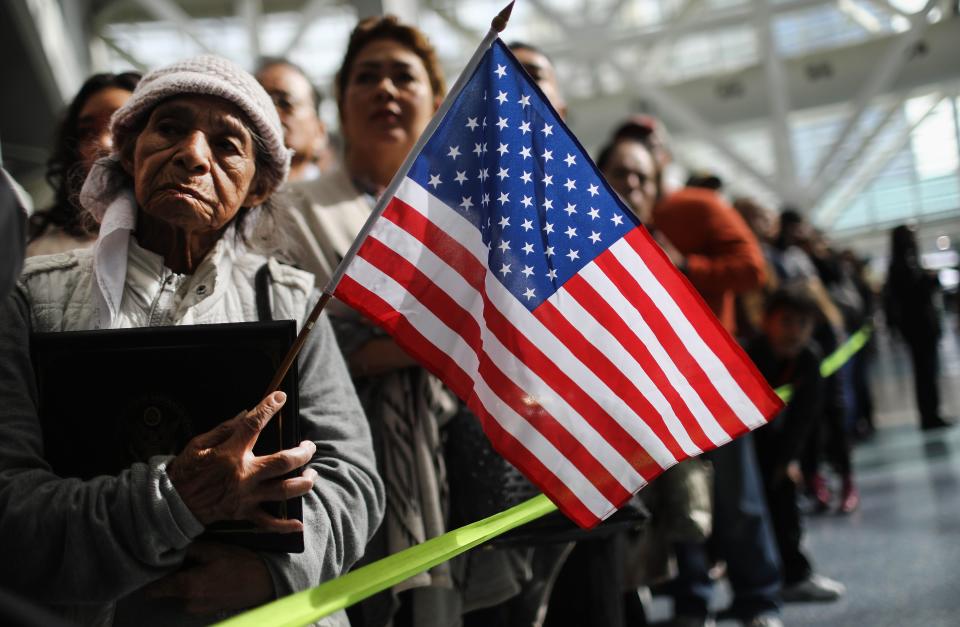 Ana Julia Ayala, an immigrant from El Salvador, waits for her son to depart a naturalization ceremony on March 20, 2018, in Los Angeles, California. The naturalization ceremony welcomed more than 7,200 immigrants from over 100 countries who took the citizenship oath and pledged allegiance to the American flag.