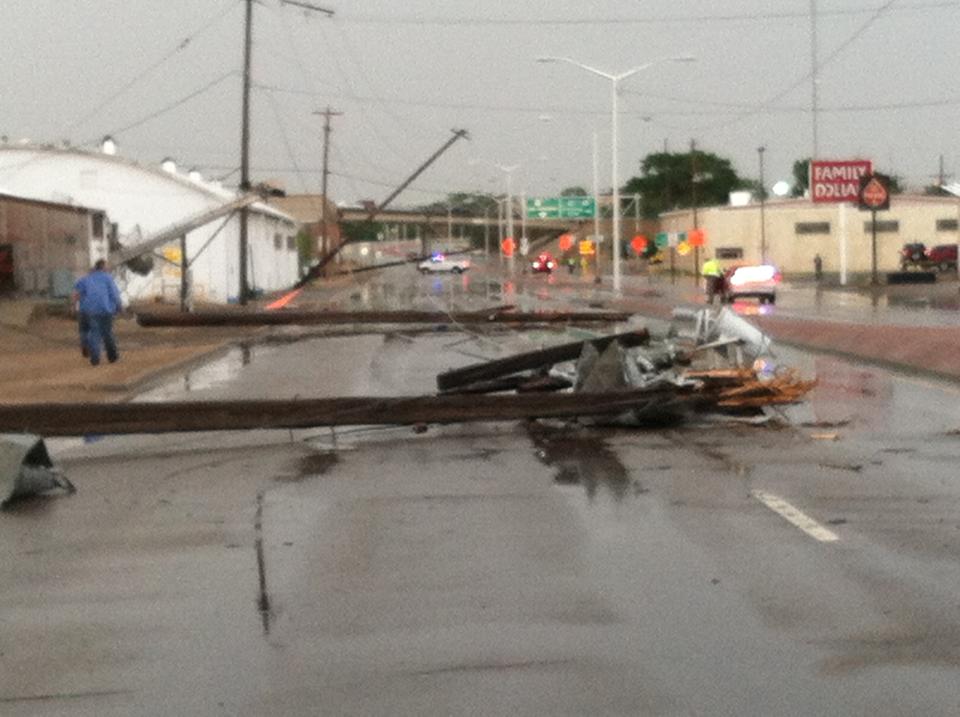 This photo provided by Mark Sarlo shows debris covering the streeet after severe weather passed through the area on Monday, June 17, 2013 in La Junta, Colo. National Weather Service spokeswoman Nezette Rydell said the tornado knocked down power poles in an industrial park near La Junta on Monday, but no injuries have been reported. More storms are expected on Tuesday. La Junta Fire Chief Aaron Eveatt said high winds raked the city, knocking down power poles in town and forcing the closure of a U.S. Highway 50, a main highway. (AP Photo/Mark Sarlo)