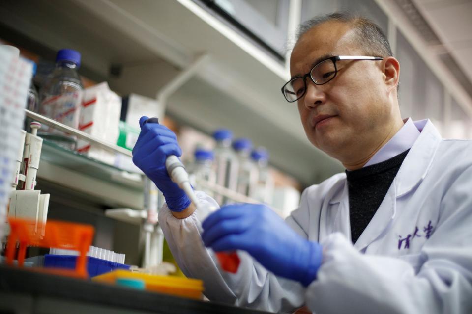 FILE PHOTO: Scientist Linqi Zhang demonstrates work in his laboratory where he researches novel coronavirus disease (COVID-19) antibodies for possible use in a drug at Tsinghua University's Research Center for Public Health in Beijing, China, March 30, 2020. REUTERS/Thomas Peter