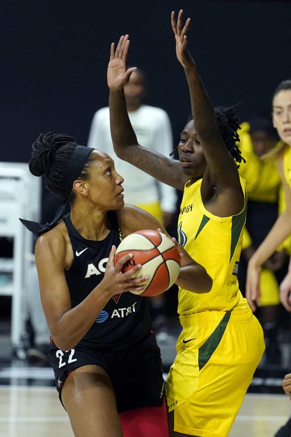 Las Vegas Aces center A'ja Wilson (22) goes up against Seattle Storm forward Natasha Howard (6) during the first half of Game 1 of basketball's WNBA Finals Friday, Oct. 2, 2020, in Bradenton, Fla. (AP Photo/Chris O'Meara)