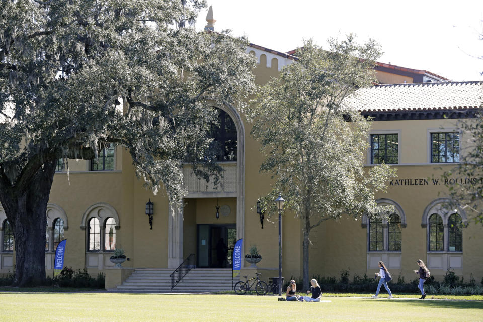 In this Tuesday, Jan. 28, 2020 photo, students are seen on campus at Rollins College in Winter Park, Fla. Because of the federal privacy law, university administrators, if called upon, won't be able to disclose students' sex, race or Hispanic origin on the 2020 Census form.(AP Photo/John Raoux)