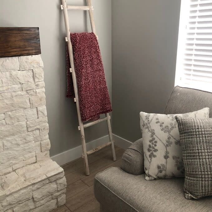 a reviewer photo of the blanket ladder with five rungs