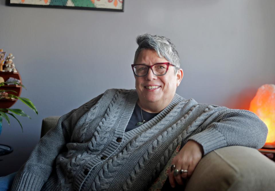 Kathy Flores, pictured at her home in Appleton, Wisconsin, is the former anti-violence program director for Diverse & Resilient, a Milwaukee-based nonprofit focused on LGBTQ+ safety and well-being.