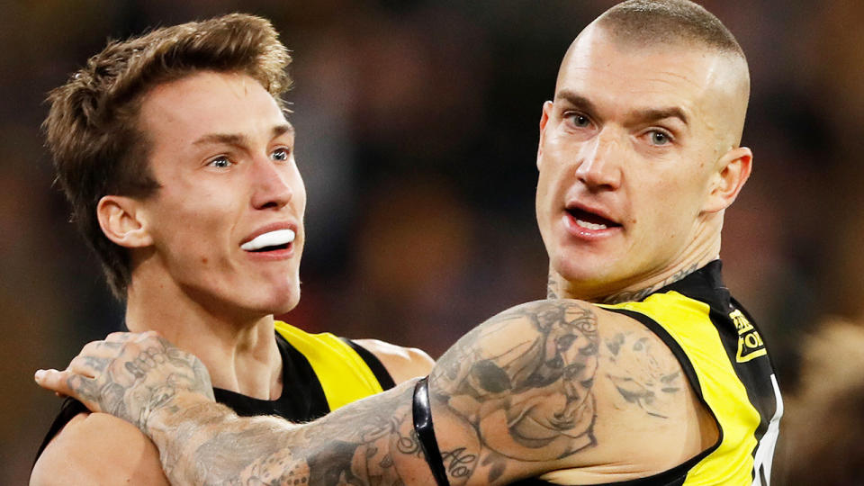 Dustin Martin celebrates a goal with a Richmond Tigers teammate.