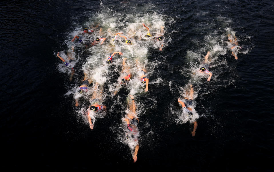 <p>Athletes during the swimming leg of the women's first race during the Super League Triathlon Championship 2021 in London. Picture date: Sunday September 5, 2021. (Photo by Steven Paston/PA Images via Getty Images)</p>
