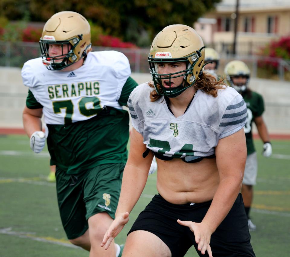 St. Bonaventure's Shaun Torgeson (right) is one of the most dominant offensive linemen in the county.