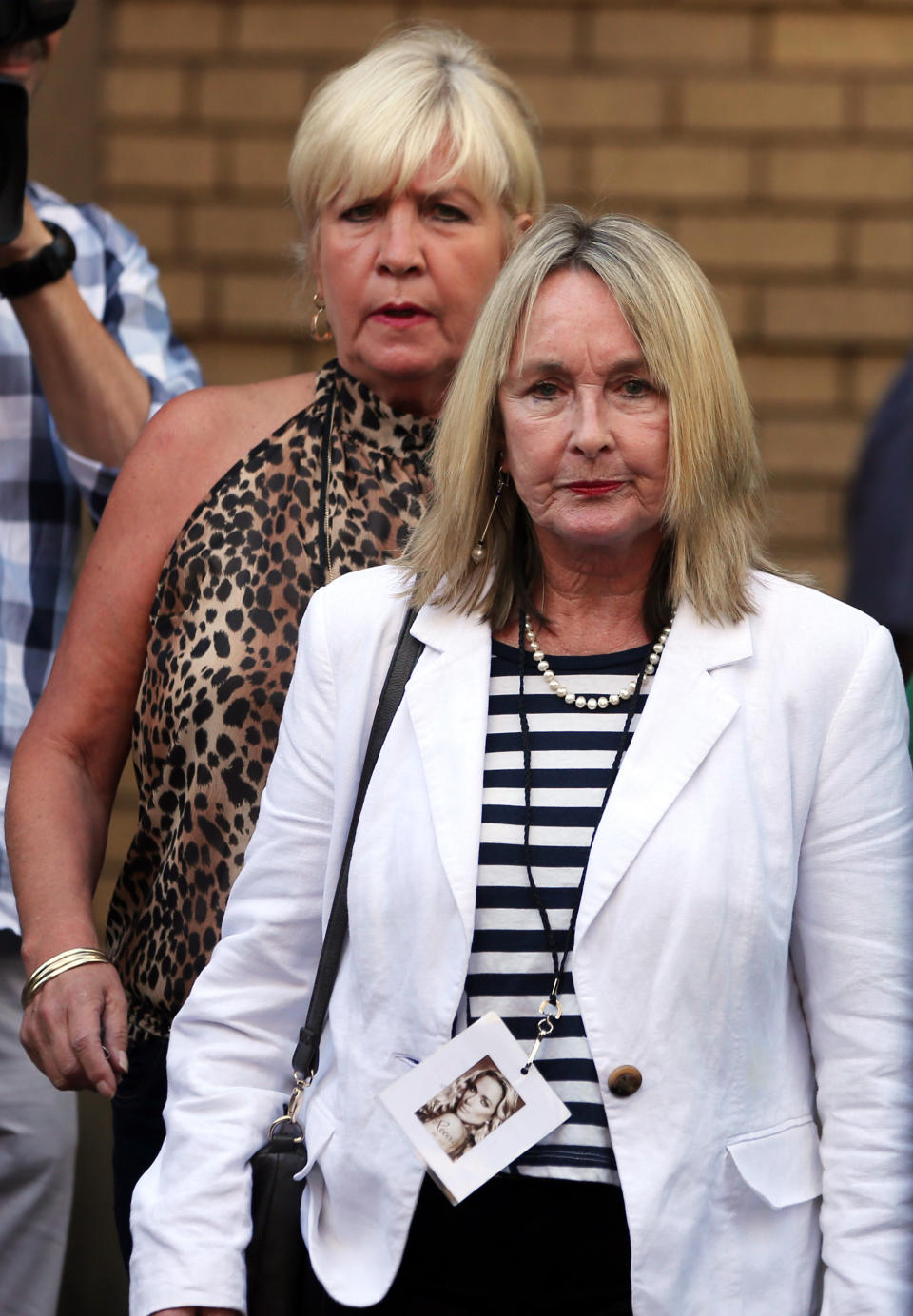June Steenkamp, mother of Reeva Steenkamp, right, with unidentified woman leaves the high court in Pretoria, South Africa, Monday, March 24, 2014. Oscar Pistorius is charged with murder for the shooting death of his girlfriend, Reeva Steenkamp, on Valentines Day in 2013. (AP Photo/Themba Hadebe)