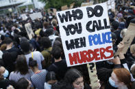 Protesters gather in front of the Paris courthouse, Tuesday, June 2, 2020. Thousands of people defied a police ban and converged on the main Paris courthouse for a demonstration to show solidarity with U.S. protesters and denounce the death of a black man in French police custody. The demonstration was organized to honor Frenchman Adama Traore, who died shortly after his arrest in 2016, and in solidarity with Americans demonstrating against George Floyd's death. (AP Photo/Rafael Yaghobzadeh)