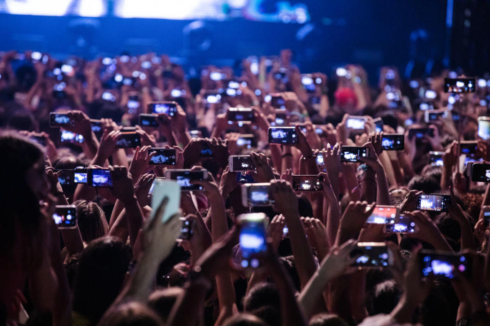 People with their phones out at a concert