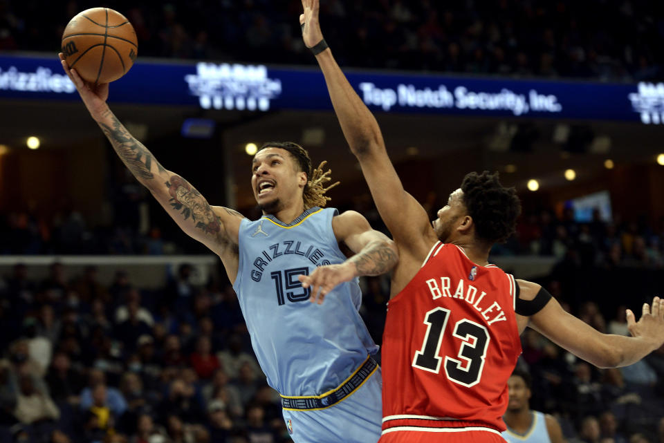 Memphis Grizzlies forward Brandon Clarke (15) shoots against Chicago Bulls center Tony Bradley (13) in the first half of an NBA basketball game Monday, Jan. 17, 2022, in Memphis, Tenn. (AP Photo/Brandon Dill)