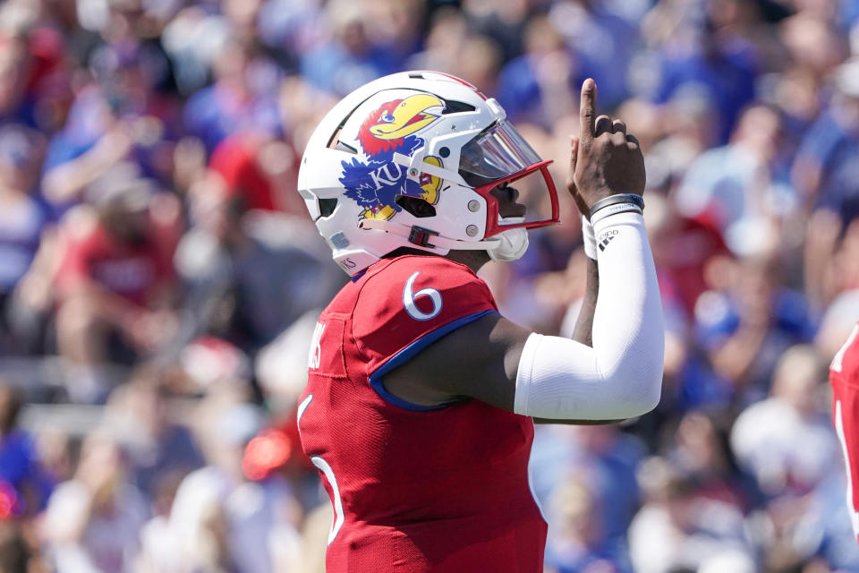 Sept. 24, 2022; Lawrence; Kansas Jayhawks quarterback Jalon Daniels (6) gestures skyward before the snap against the Duke Blue Devils during the second half of the game at David Booth Kansas Memorial Stadium. Denny Medley-USA TODAY Sports