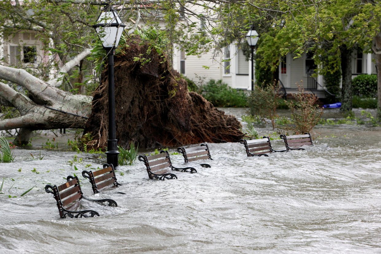 Storm surge and rainwater burst the banks of Colonial Lake and partially submerge park benches after Hurricane Matthew hit Charleston, South Carolina October 8, 2016.   REUTERS/Jonathan Drake