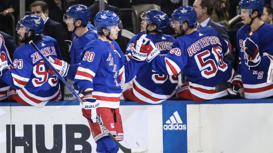 New York Rangers left wing Will Cuylle (50) celebrates with his teammates after scoring a goal in the third period against the Carolina Hurricanes at Madison Square Garden