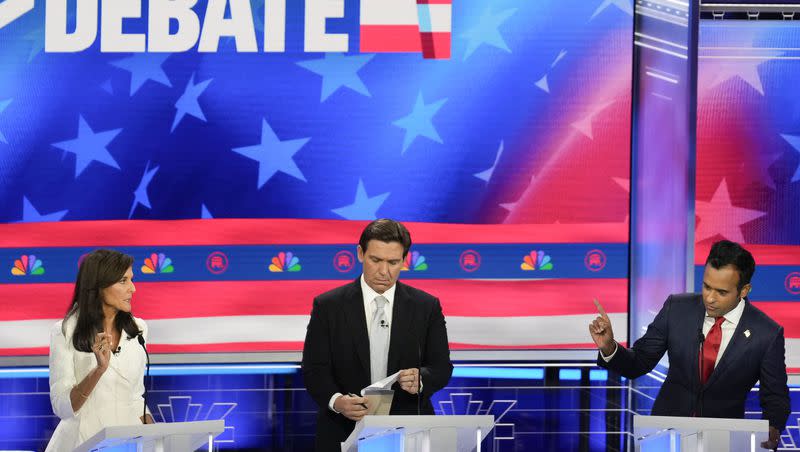 Republican presidential candidates, from left, former United Nations Ambassador Nikki Haley, Florida Gov. Ron DeSantis and businessman Vivek Ramaswamy, participate in a Republican presidential primary debate on Nov. 8, 2023, in Miami.