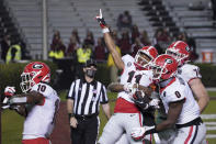 Georgia wide receiver Arian Smith (11) celebrates a touchdown against South Carolina with Darnell Washington (0), Ben Cleveland (74) and Kearis Jackson (10) during the second half of an NCAA college football game Saturday, Nov. 28, 2020, in Columbia, S.C. Georgia won 45-16. (AP Photo/Sean Rayford)