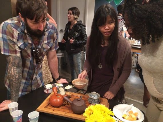 Residents sample tea from Tealet in the back of the Writer's Block store (Alana Semuels)