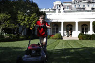 <p>Frank Giaccio, 11, of Falls Church, Va., is focused as he mows the lawn of the Rose Garden, Friday, Sept. 15, 2017, at the White House in Washington. The 11-year-old wrote President Donald Trump requesting to mow the lawn at the White House. (Photo: Jacquelyn Martin/AP) </p>