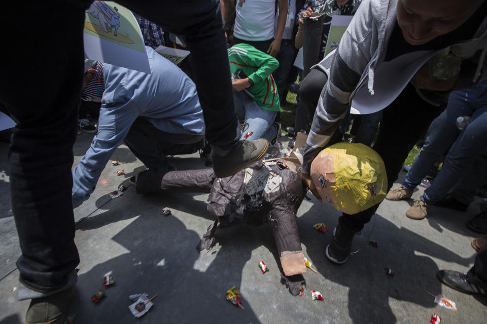 <p>Protesters break up a Donald Trump pinata near a campaign rally by the GOP presidential candidate at the Anaheim Convention Center on May 25, 2016, in Anaheim, Calif. (David McNew/Getty Images) </p>