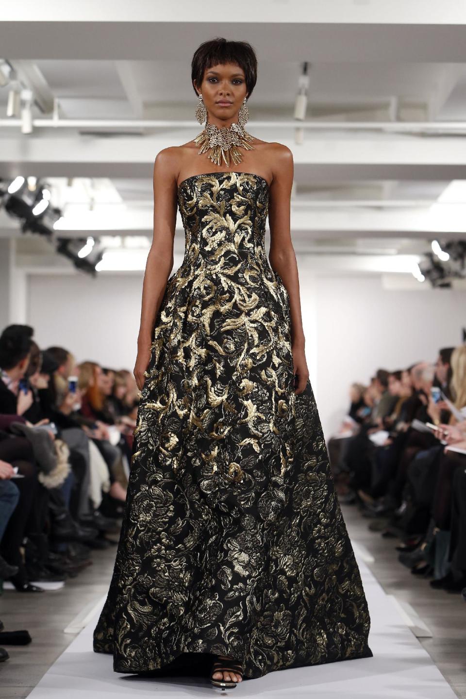 The Oscar de la Renta Fall 2014 collection is modeled during Fashion Week in New York, Tuesday, Feb. 11, 2014. (AP Photo/Jason DeCrow)