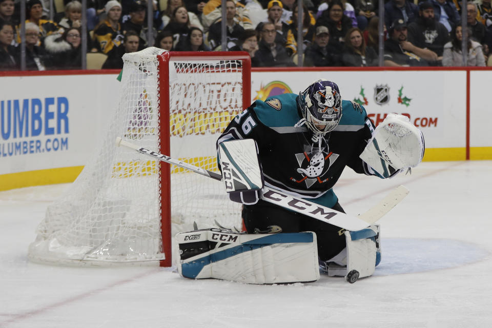 Anaheim Ducks goaltender John Gibson (36) makes a stop on the puck against the Pittsburgh Penguins during the second period of an NHL hockey game, Monday, Dec. 17, 2018, in Pittsburgh. (AP Photo/Keith Srakocic)