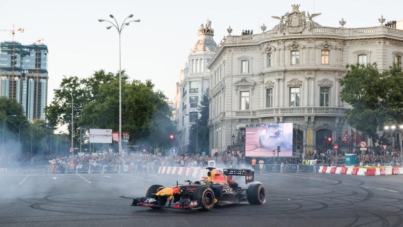  F1 driver Checo Perez drives the 'Red Bull RB7 (2011)' single-seater around the urban route between Puerta de Alcala, the Metropolis building, Cibeles and a stretch of Paseo Recoletos, on 15 July, 2023 in Madrid, Spain.