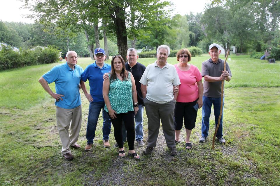 Rochester residents raising concerns about locating a new elementary school at 753 Salmon Falls Road include, from left, Paul Johnson, Ray Wayman, Sharon and Paul Johnson, John and Barbara Lopriore and Richard Cook, seen Friday, June 30, 2023. They are among many residents who are speaking out about issues such as traffic, safety and wetlands.