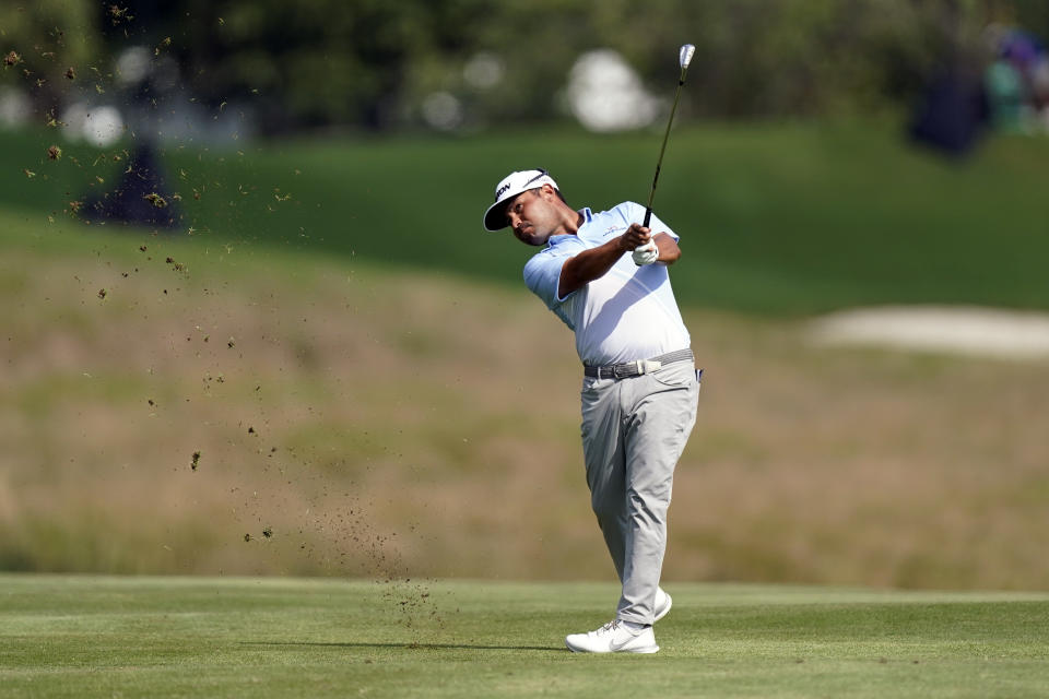 J.J. Spaun hits from the second fairway during the second round of the St. Jude Championship golf tournament Friday, Aug. 12, 2022, in Memphis, Tenn. (AP Photo/Mark Humphrey)