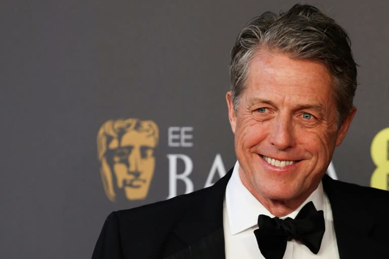 British actor Hugh Grant says he was offered an "enormous sum" not to go to court against the publishers of The Sun tabloid (Adrian DENNIS)