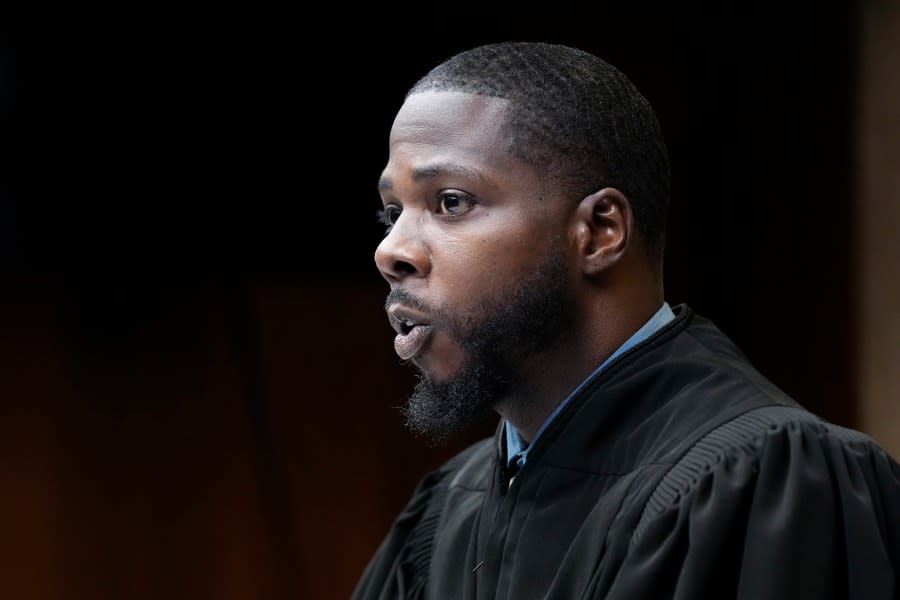 Judge Kwame Rowe presides over the sentencing hearing of Ethan Crumbley, Friday, Dec. 8, 2023, in Pontiac, Mich. Parents of students killed at Michigan’s Oxford High School described the anguish of losing their children Friday as the judge considered whether Crumbley, a teenager, will serve a life sentence for a mass shooting in 2021. Crumbley, 17, could be locked up with no chance for parole for killing four fellow students and wounding others. (AP Photo/Carlos Osorio, Pool)