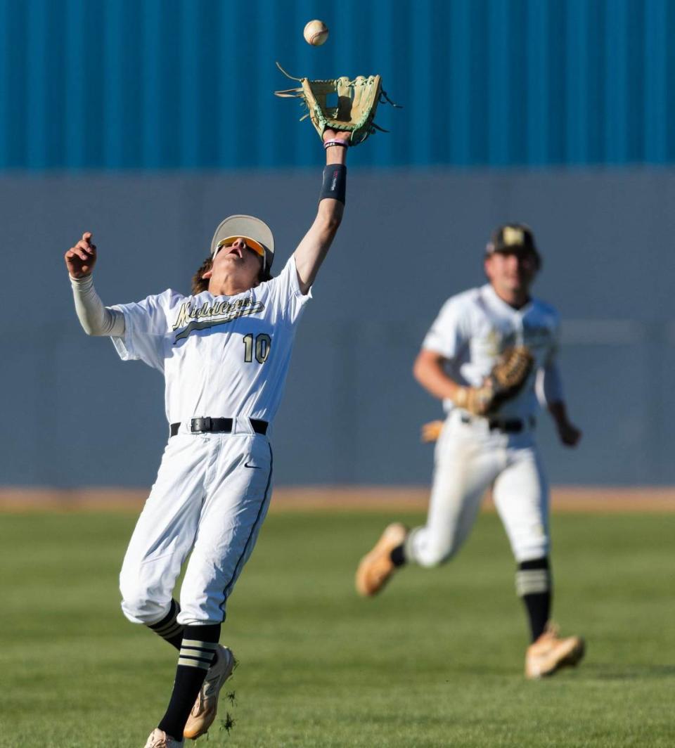 Middleton infielder Cam Lenius catches an Eagle blooper behind second base during the 5A District Three baseball championship at May 9.