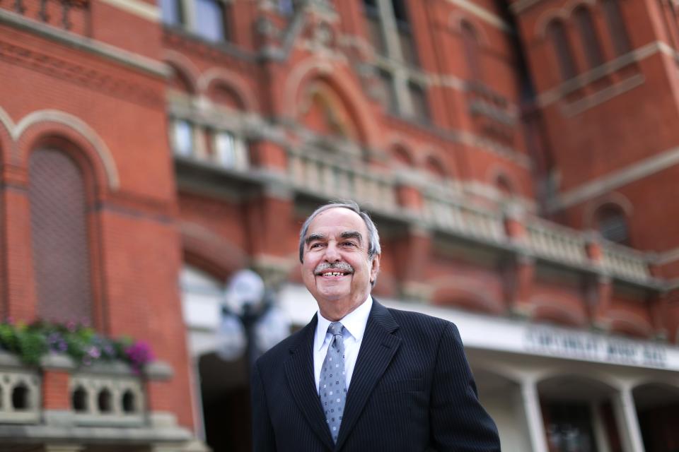 Robert Porco is in his 35th year as the Director of Choruses for the Cincinnati May Festival. He is photographed in front of Music Hall in Over-the-Rhine on the occasion of his 25th year.