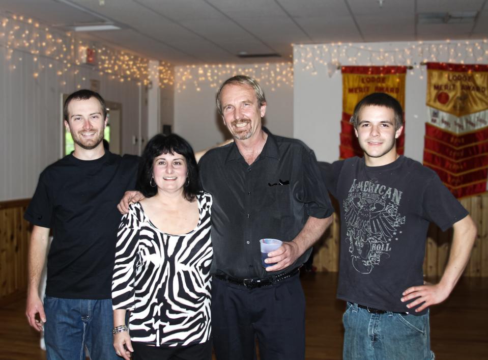 Janet and Kenneth Lindquist, center, flanked by sons Eric, right, and Matthew, left. Janet, Kenneth and Matthew were killed in December 2017.