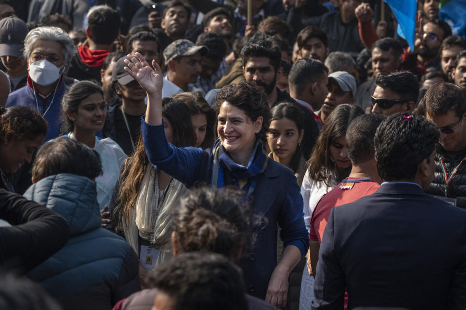 India's opposition Congress party leader Priyanka Gandhi, centre, waves to her supporters during a march, in New Delhi, India, Saturday, Dec. 24, 2022. Rahul Gandhi, leader of India's beleaguered opposition Congress party, on Saturday marched in New Delhi along with his supporters, part of his five-month-long 3,570km (2,218-mile) countrywide trek through 12 states that began 105 days ago.(AP Photo/Altaf Qadri)