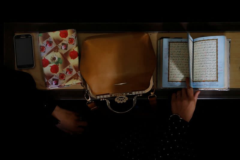 Afghan women learn how to read the Koran in a madrasa or religious school in Kabul