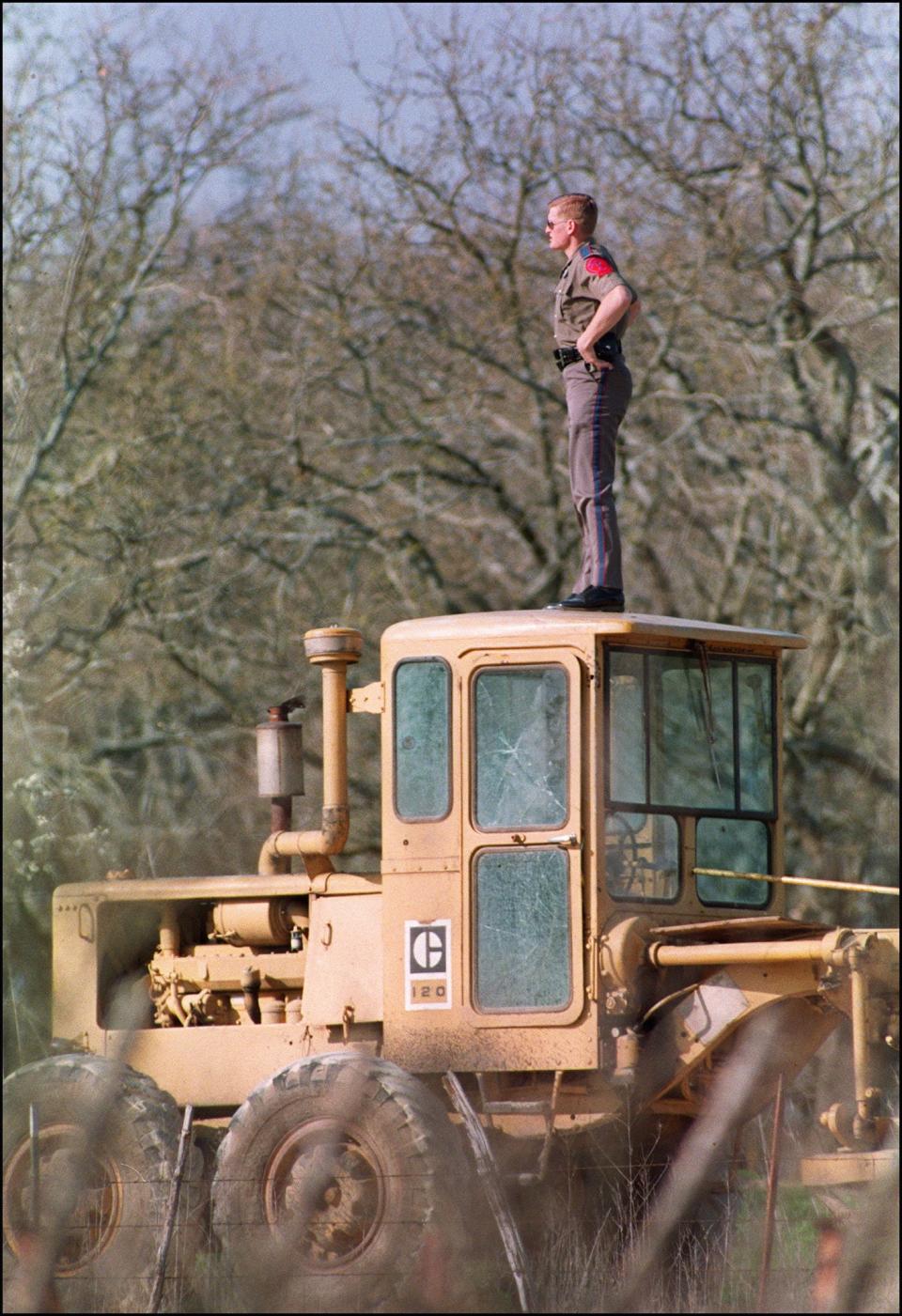 An officer surveys the Branch Davidian compound in 1993.