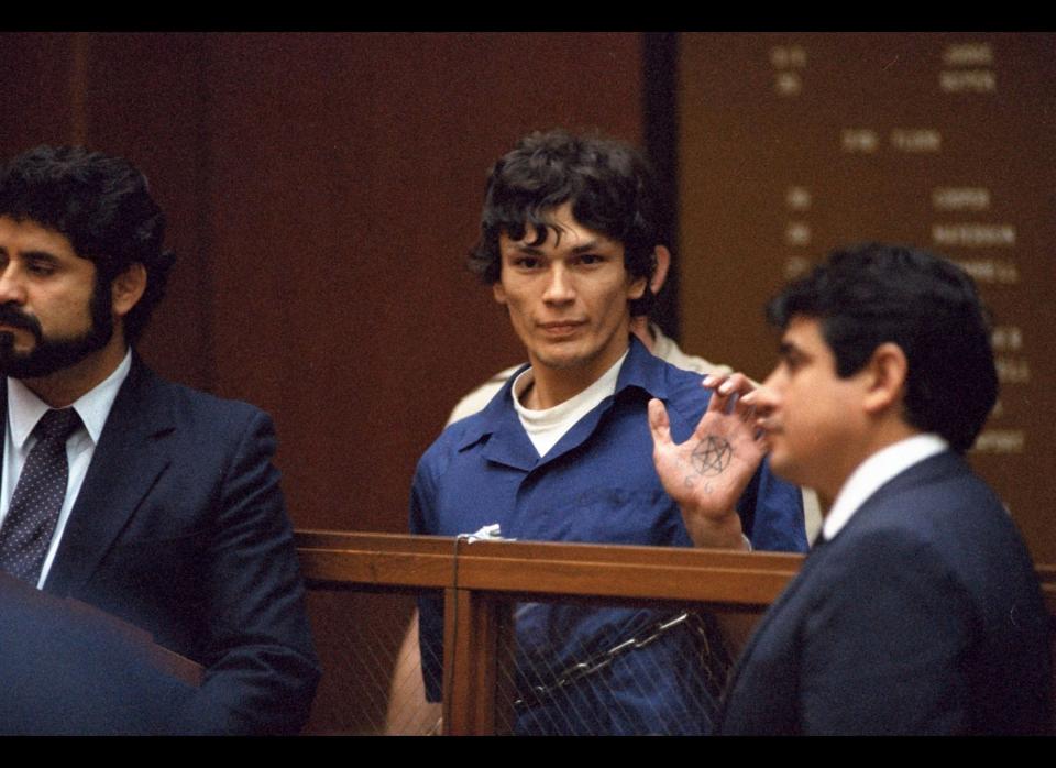 In this file photo taken Oct. 24, 1985, "Night Stalker" Richard Ramirez displays a pentagram symbol on his hand inside a Los Angeles courtroom. The California Supreme Court Monday< Aug. 7, 2006, upheld the convictions and death sentence for serial killer Richard Ramirez, the so-called "Night Stalker" whose killing spree terrorized the Los Angeles area in the mid 1980s. Ramirez, now 46, was sentenced to death in 1989 for 13 Los Angeles-area murders committed in 1984 and 1985. Satanic symbols were left at some murder scenes and some victims were forced to "swear to Satan" by the killer, who broke into homes through unlocked windows and doors. (AP Photo/Lennox McLendon)