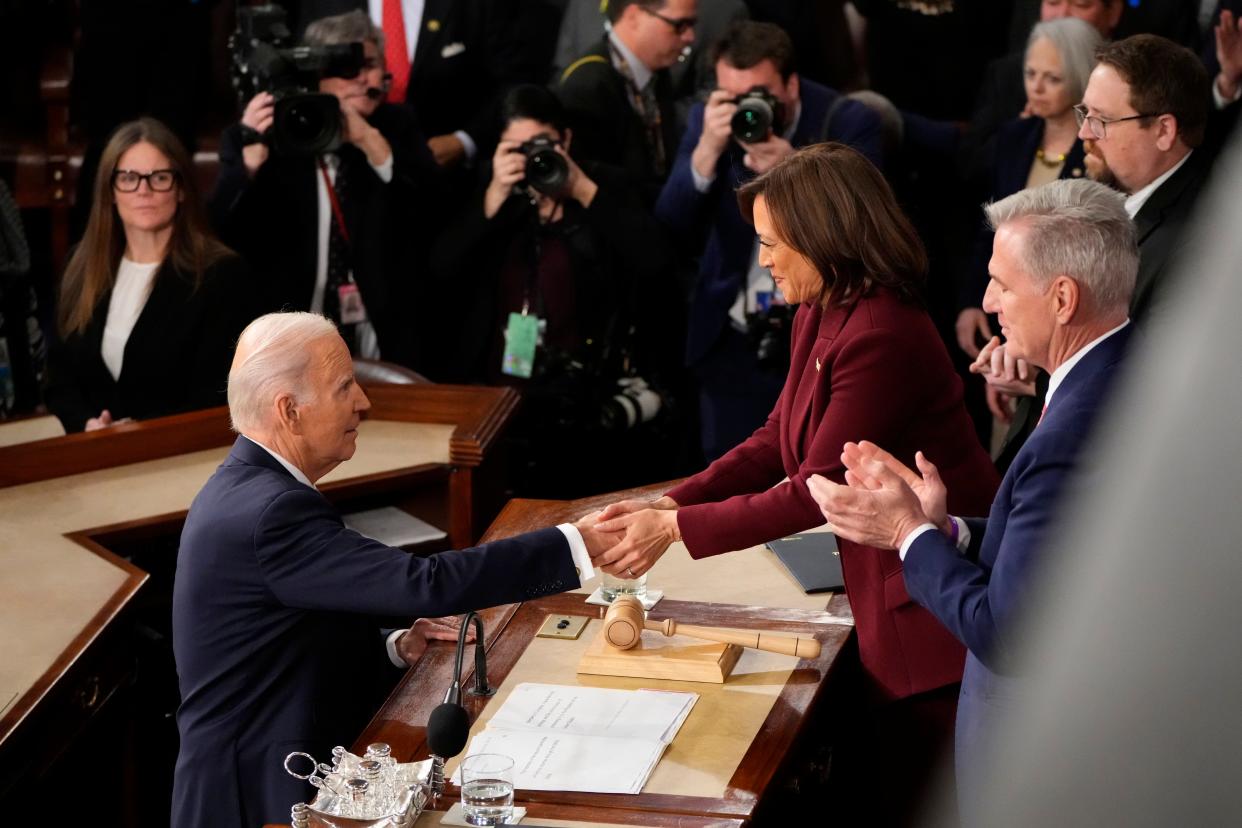 President Joe Biden shakes the hand of Vice President Kamala Harris after the State of the Union address from the House chamber of the United States Capitol in Washington. 