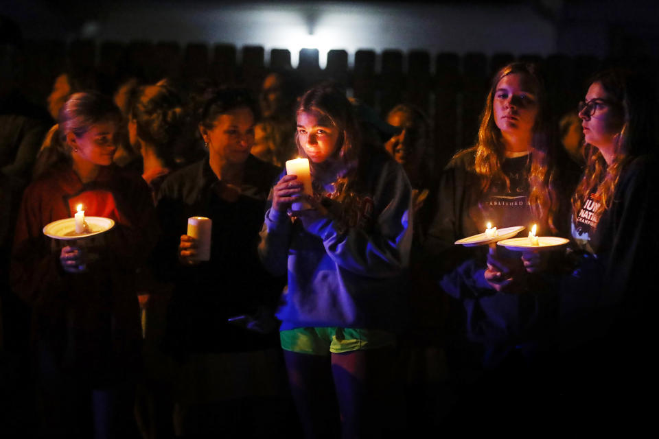 Thousands of runners, supporters and mourners attend a 4:20 a.m "Let's Finish Liza's Run" event in honor of Eliza Fletcher on Friday, Sept. 9, 2022 in Memphis, Tenn. Fletcher, was kidnapped and murder while running last week. (Mark Weber/Daily Memphian via AP)