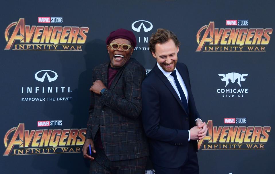 <p>Nick Fury and former nemesis Loki had a laugh while posing for photogs. (Photo: Frederic J. Brown / AFP) </p>