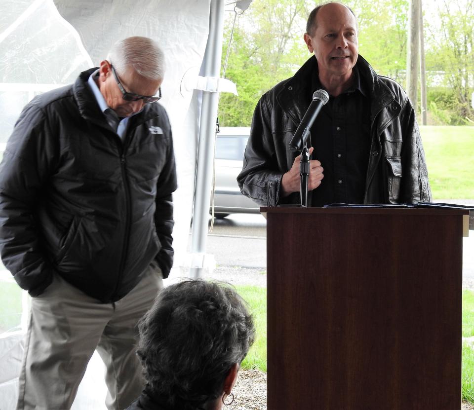 Commissioner Dane Shryock listens to former Sen. Jay Hottinger speak at the dedication ceremony for Skip's Landing. Hottinger helped to secure funding for purchase of the land from the state capital improvement budget.