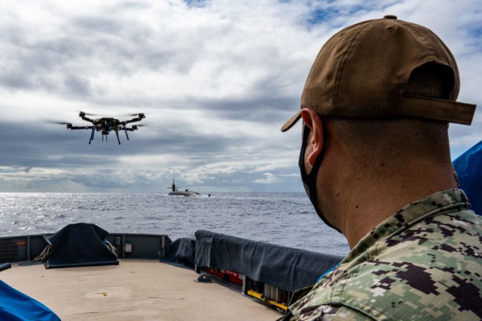 Electronics Technician, Submarine, Navigation 1st Class Carlos Gonzalez, assigned to Commander, Submarine Force, U.S. Pacific Fleet, pilots an unmanned aerial vehicle after delivering a payload to the Ohio-class ballistic-missile submarine USS Henry M. Jackson (SSBN 730) around the Hawaiian Islands