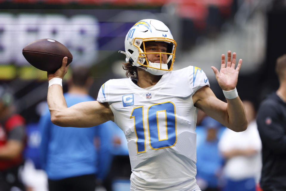 CORRECTS DATE TO SUNDAY, NOV. 6 INSTEAD OF TUESDAY, DEC. 6 - Los Angeles Chargers quarterback Justin Herbert warms up before an NFL football game against the Atlanta Falcons, Sunday, Nov. 6, 2022, in Atlanta. (AP Photo/Butch Dill)