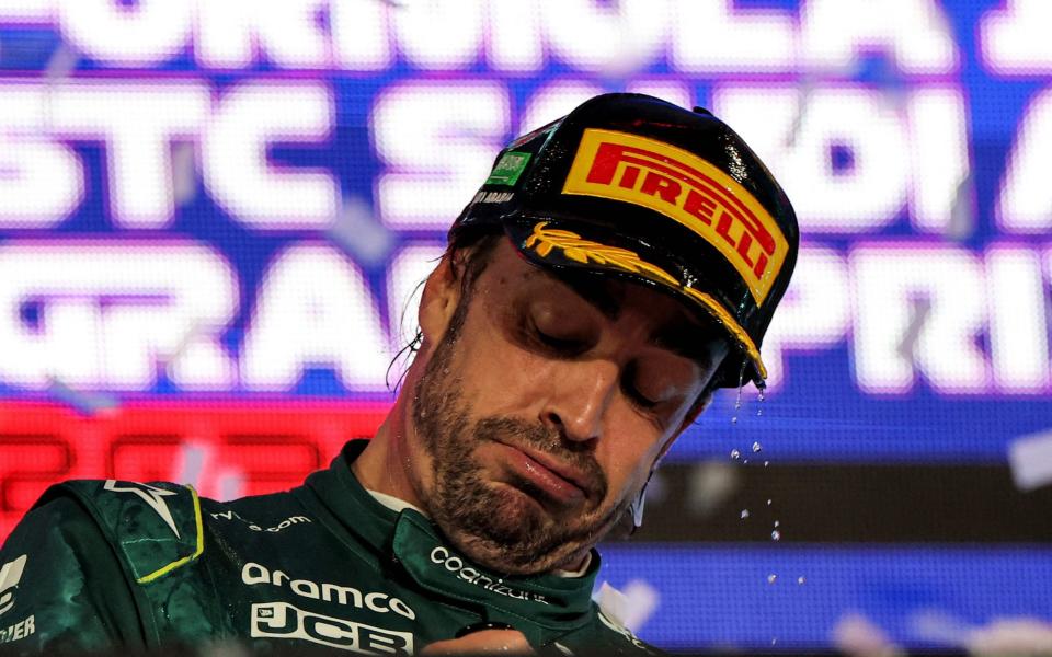 Aston Martin's Spanish driver Fernando Alonso reacts on the podium at the end of the Saudi Arabia Formula One Grand Prix at the Jeddah Corniche Circuit in Jeddah on March 19, 2023 - Getty Images/Giuseppe Cacace