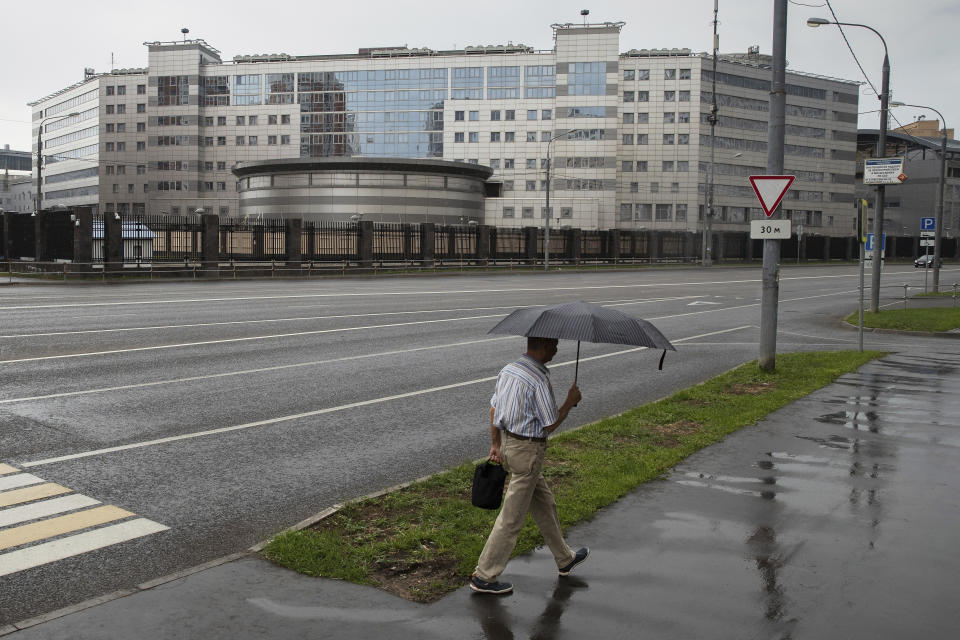 FILE - In this file photo taken on Saturday, July 14, 2018, a man walks past the building of the Russian military intelligence service in Moscow, Russia. The leak of an alleged Russian hacker’s conversations with a security researcher shows more about the shadowy group of 12 Russian spies indicted by the FBI last month for targeting the 2016 U.S. election. (AP Photo/Pavel Golovkin, File)