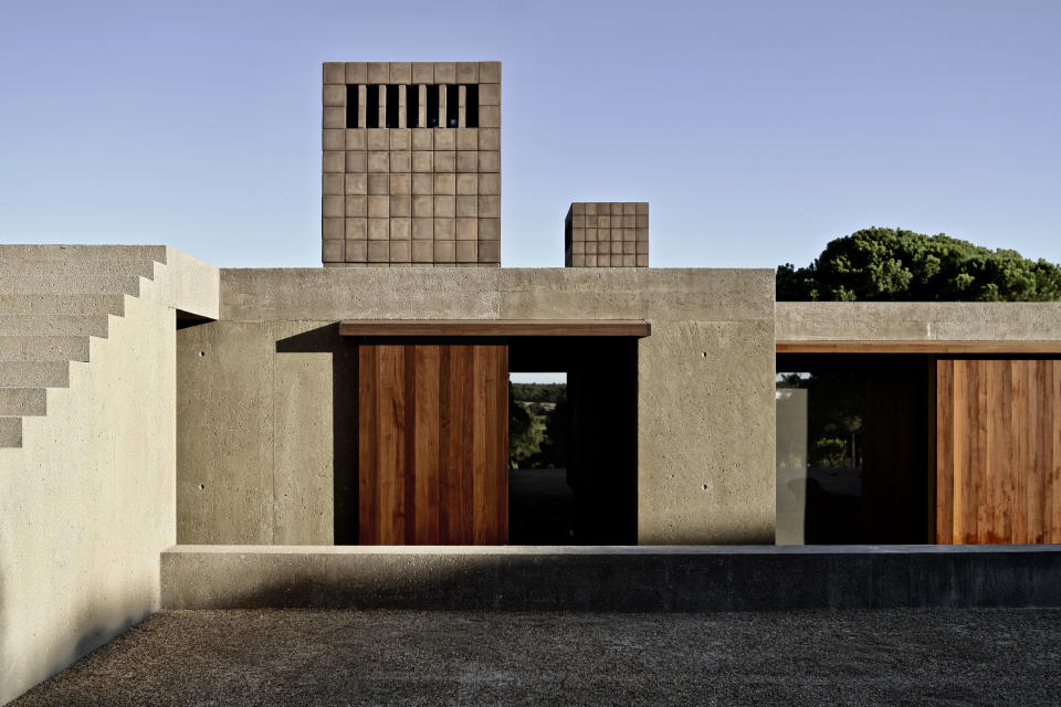 Vincent Van Duysen and his team designed Casa M in Melides, Portugal. The structure blends in seamlessly, camouflaged by the rolling hills, dunes and cork trees of Alentejo. Courtesy of Vincent Van Duysen Artchitects BV