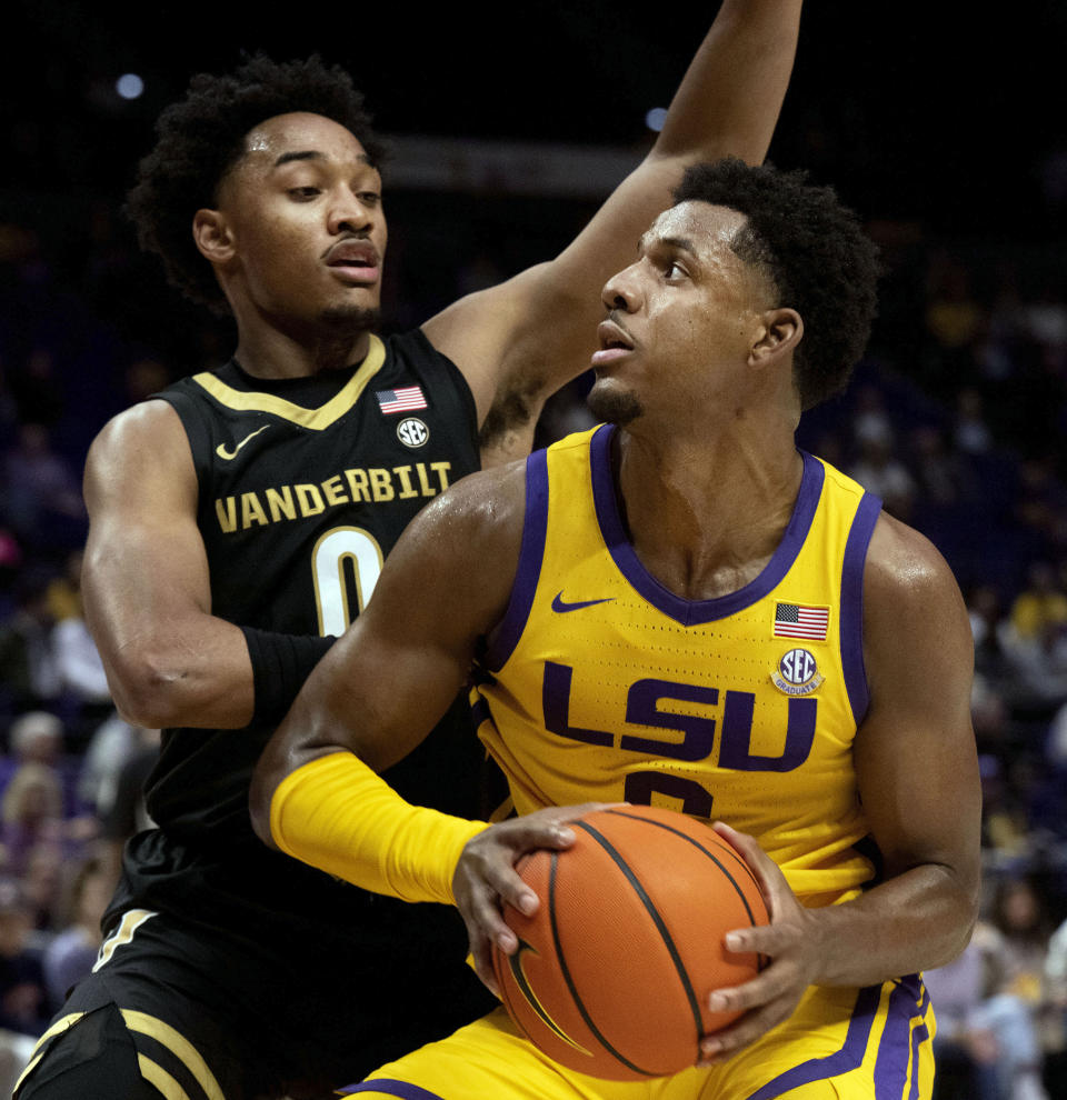 LSU guard Jordan Wright (6) drives to the basket past Vanderbilt guard Tyrin Lawrence (0) during an NCAA college basketball game, Tuesday, Jan. 9, 2024 in Baton Rouge, La. (Hilary Scheinuk/The Advocate via AP)