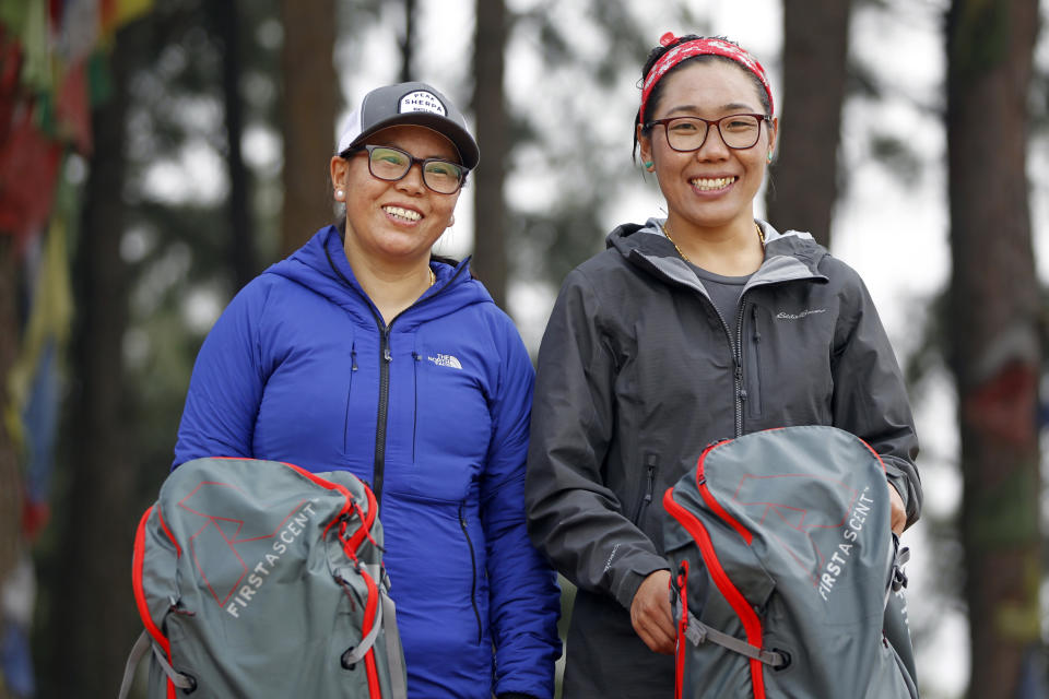 In this photo taken Saturday, March 30, 2019, Nima Doma, 34, right, and Furdiki Sherpa, 43, stand for photographs after their morning exercise as they train to summit Mount Everest, in Kathmandu, Nepal. Five years after one of the deadliest disasters on Mount Everest, three people from Nepal's ethnic Sherpa community, including Doma and Sherpa, are preparing an ascent to raise awareness about the Nepalese mountain guides who make it possible for hundreds of foreign climbers to scale the mountain and survive. The two women lost their husbands in the 2014 ice avalanche on Everest’s western shoulder that killed 16 fellow Sherpa guides. (AP Photo/Niranjan Shrestha)