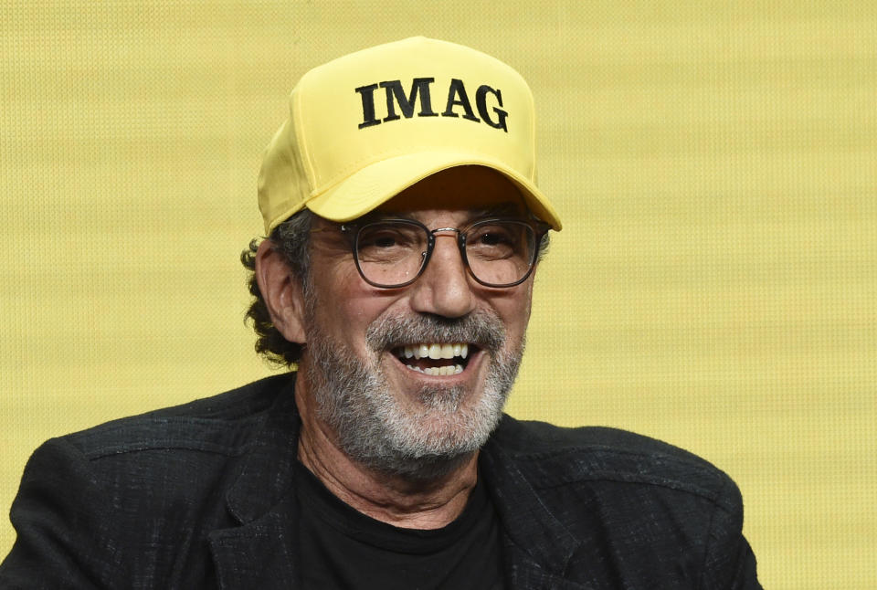 Chuck Lorre, executive producer of the CBS series "Bob Hearts Abishola," wears a hat with initials that he said stand for "Immigrants Make America Great" during a panel discussion on the show at the Summer 2019 Television Critics Association Press Tour at the Beverly Hilton, Thursday, Aug. 1, 2019, in Beverly Hills, Calif. (Photo by Chris Pizzello/Invision/AP)